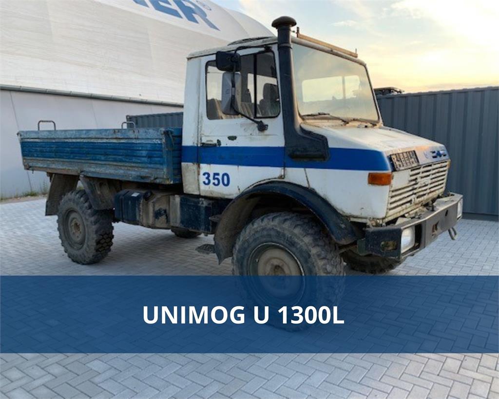 ONLINE-AUCTION UNIMOG + 3-side dump truck Schmitz Cargobull