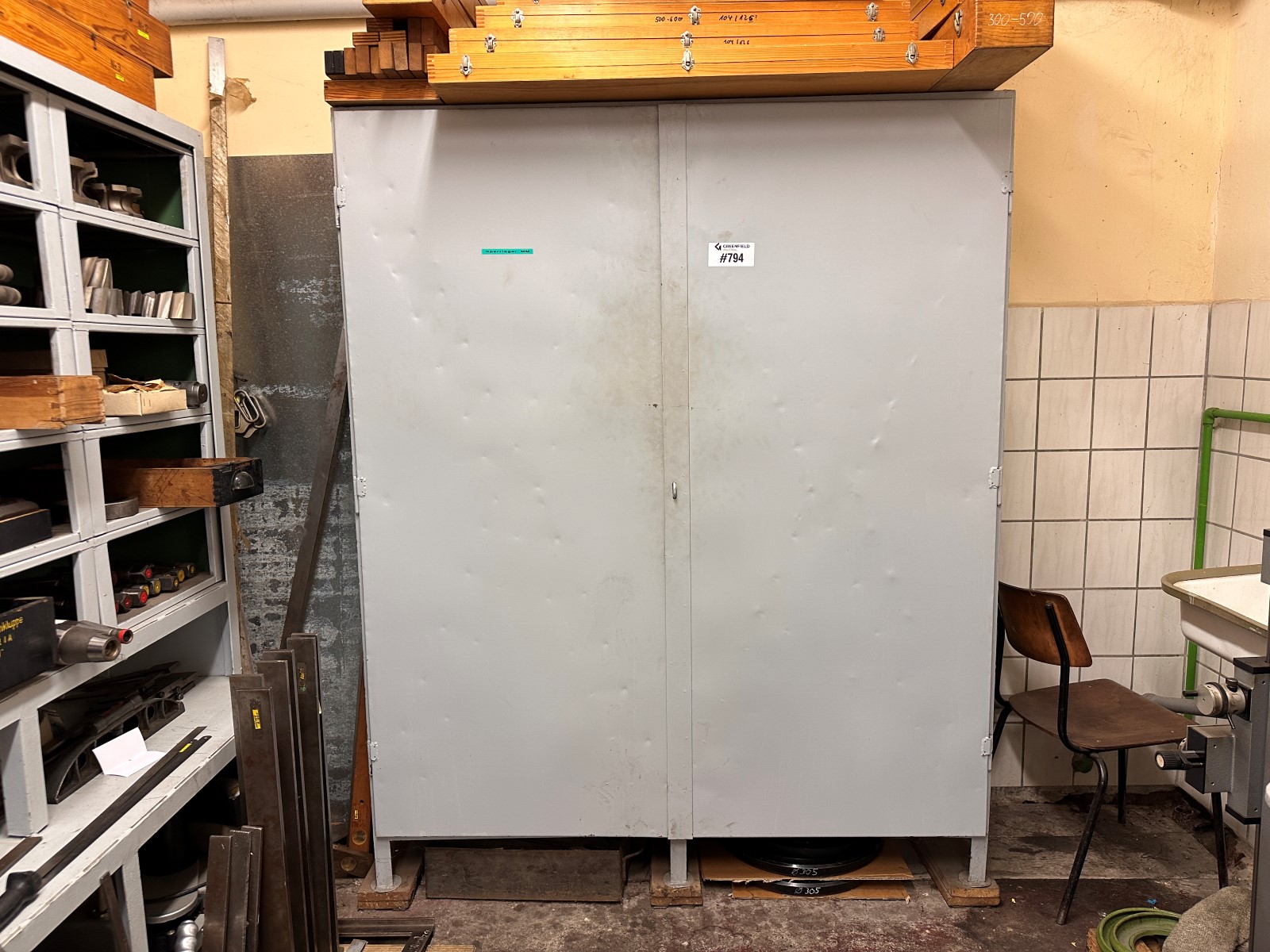 Sheet steel cabinet with contents