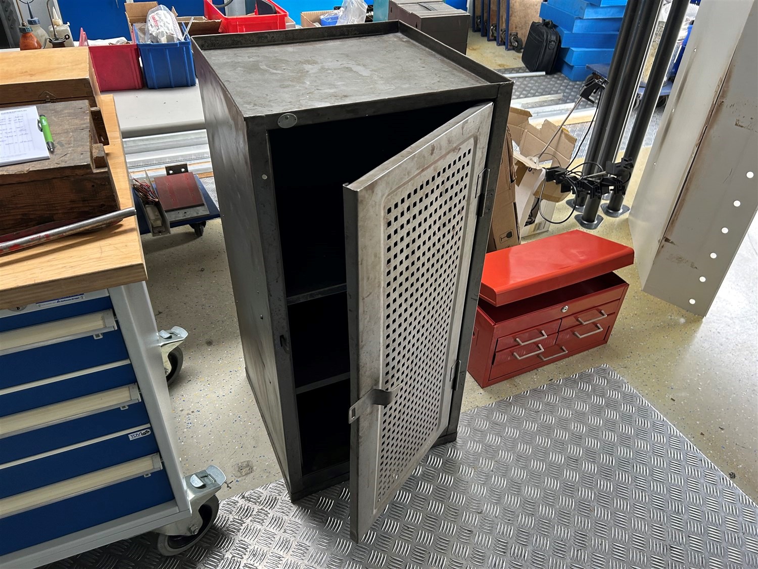 Workshop cupboard with perforated metal door