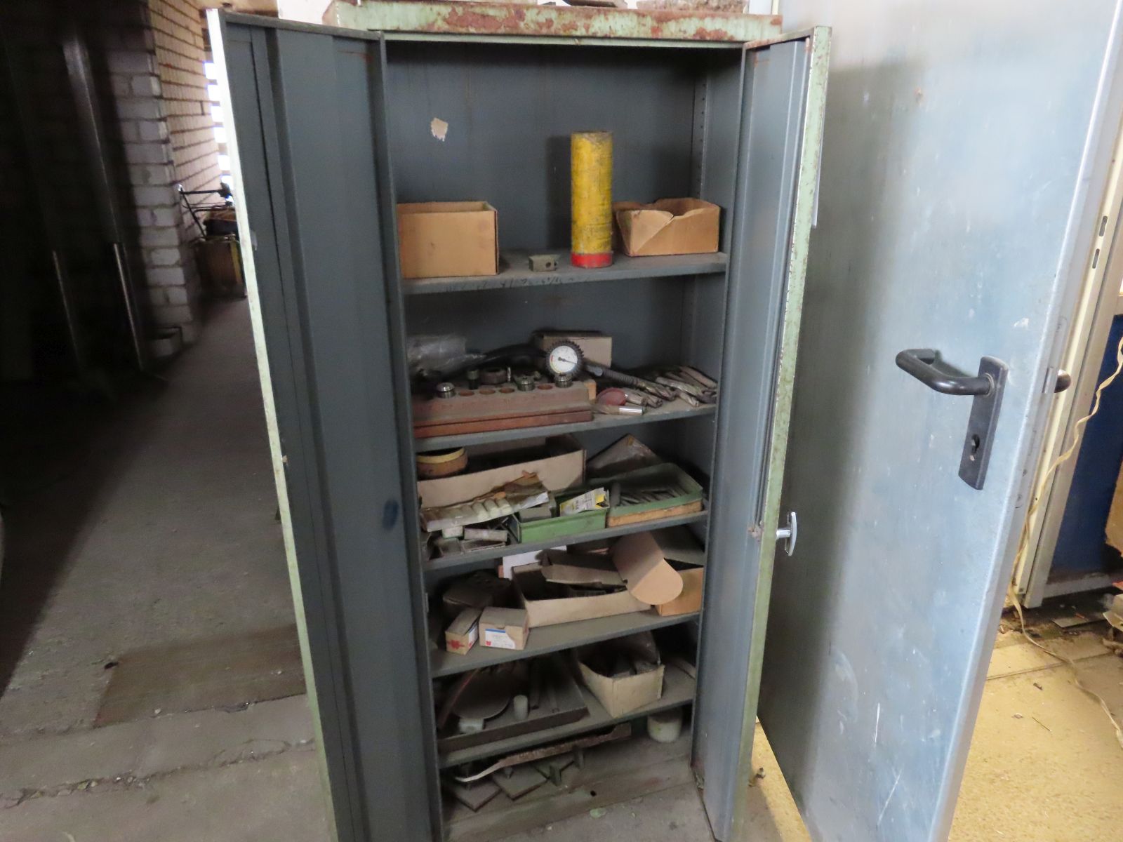 Sheet steel cabinet with contents